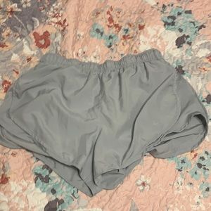 silver nike women’s shorts, size large